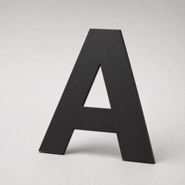 Installation de lettres Dibond noir sur mur intérieur d’accueil