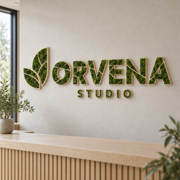 ORVENA STUDIO-skilt med grøn mos på en træbund, monteret på væggen i et studio