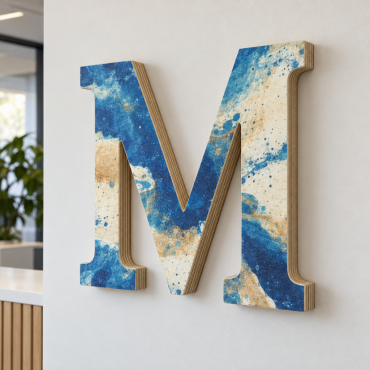 Letter M in plywood, printed with a blue and sand abstract pattern, with a visible laminated edge, fixed to a reception wall